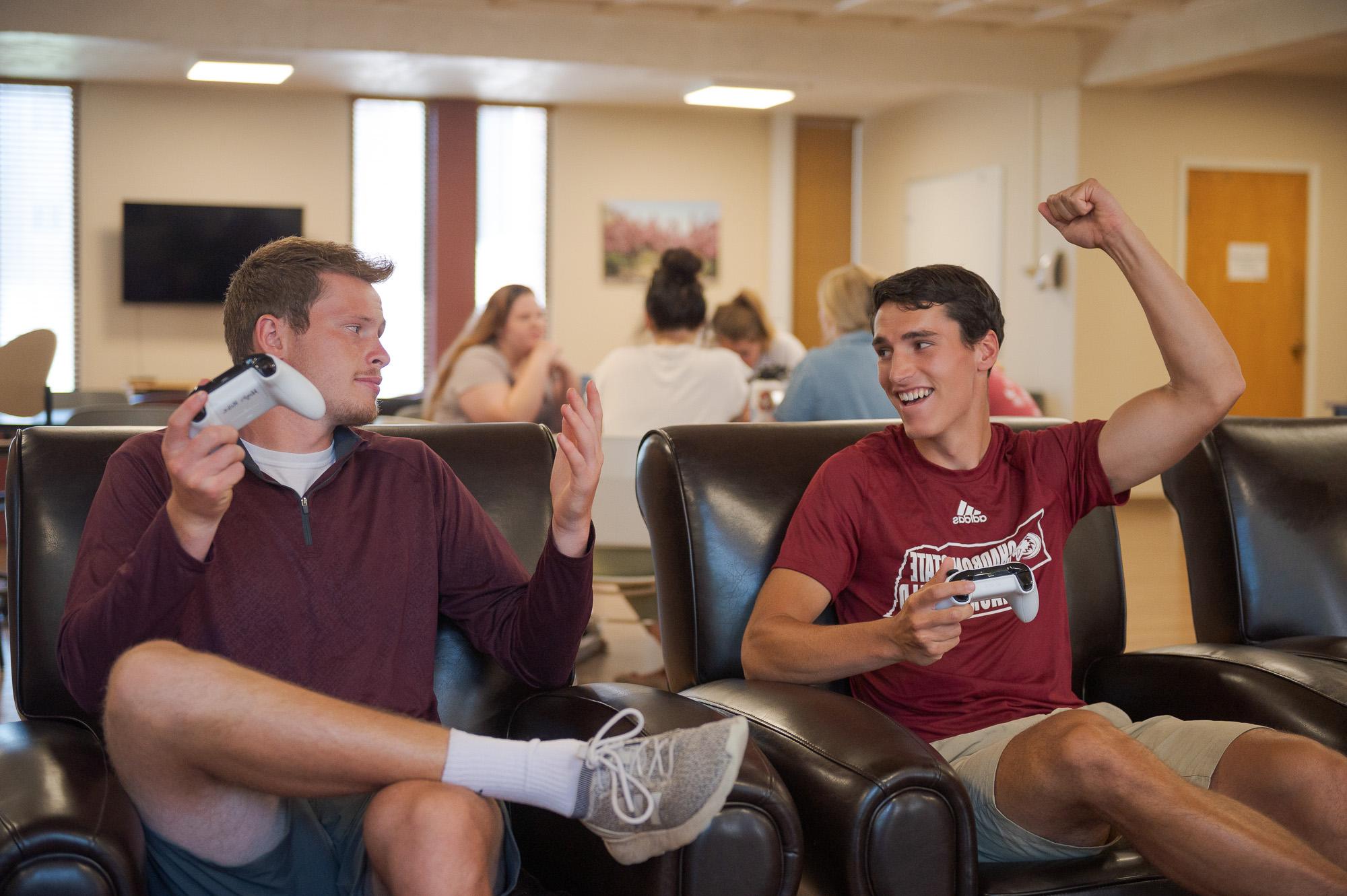 Students cheering in the Hub